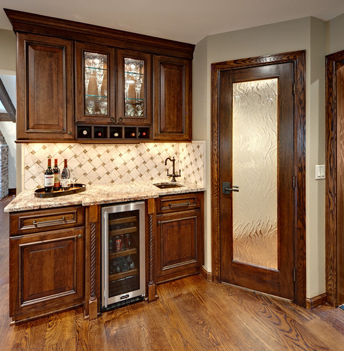 Tumbled Limestone Backsplash with Ceramic Connection with Typhoon Bordeaux Granite Countertop and Cherry Havana Stained Cabinets